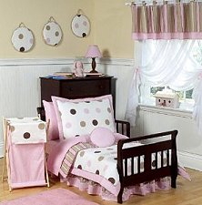 pink and chocolate mod dots 5-piece toddler bedding ensemble has all that your little one will need. This modern children's bedding set uses exclusive Jojo designer coordinating 100% cotton prints. The 3 prints are made in a color palette of soft pink, cocoa brown, white and chocolate. They include large dots, bold stripes, and mini dots prints. This set will create a stylish room that your little one is sure to enjoy. 