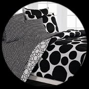 Right there in black and white. Give her a total bedroom makeover with the CHF Spot the Dot Mini Bed in a Bag Set. White and black dots of all sizes make this bed in a bag pop. It's made of luxurious natural cotton to be machine-washable and comes in a variety of size options. You get the comforter as well as matching sheets, pillow cases, and shams. Dots are hot, and this graphic Spot The Dot mini complete bedroom ensemble takes a dramatic modern approach to this trendy motif. The face of the comforter and the standard flanged pillow sham features huge black dots on a white background; the bottom third of the comforter is highlighted by a positive/negative effect, featuring a wide horizontal band of white dots on a black ground. Comforter reverses to the same print.